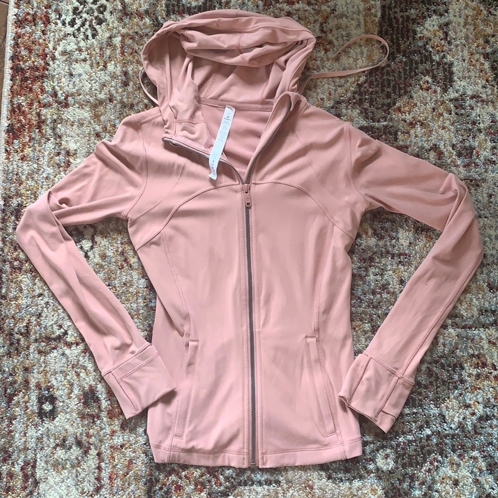 Cute light pink lululemon zip up jacket. Some pilling, lightly worn.